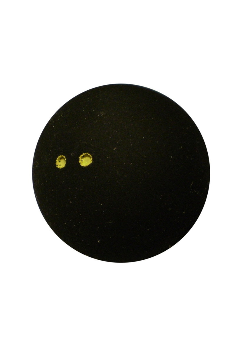 Close-up of Dunlop Pro squash ball with two yellow dots.