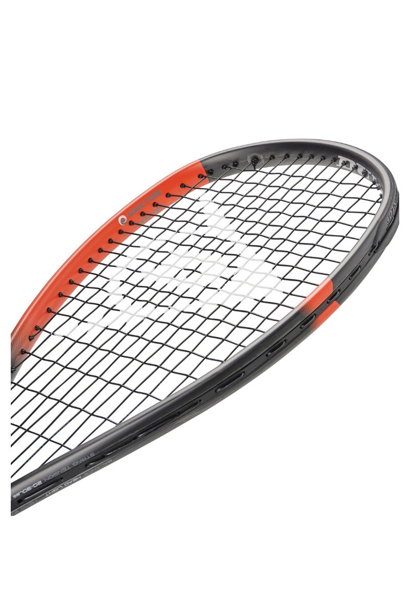 Close-up view of the Dunlop Sonic Core Revelation Pro Lite squash racket's head with a black and red frame and black strings.